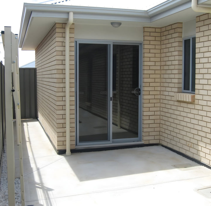 Austral standard 28 clothesline mounted on steel posts in classic cream, folded down