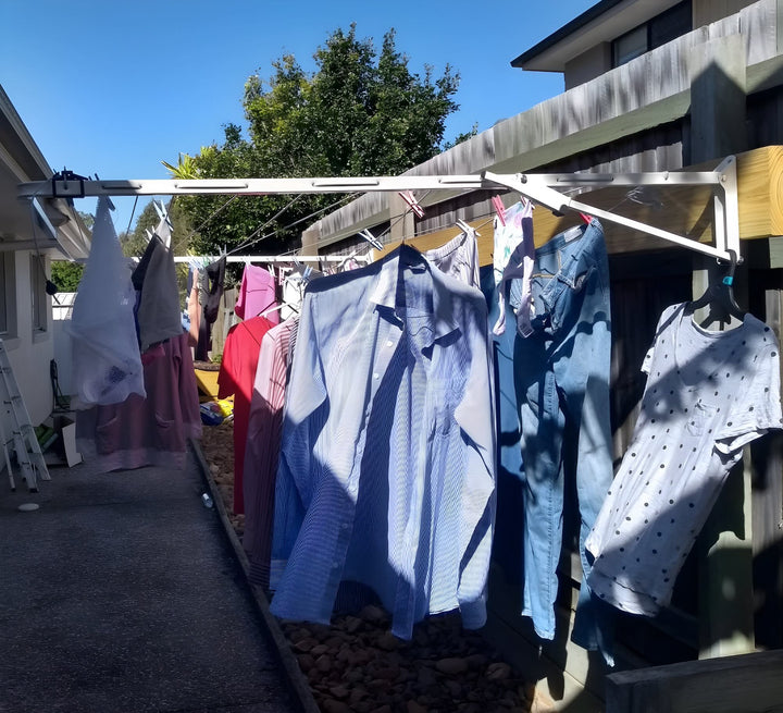 Austral standard 28 clothesline mounted on fence in Surfmist colour