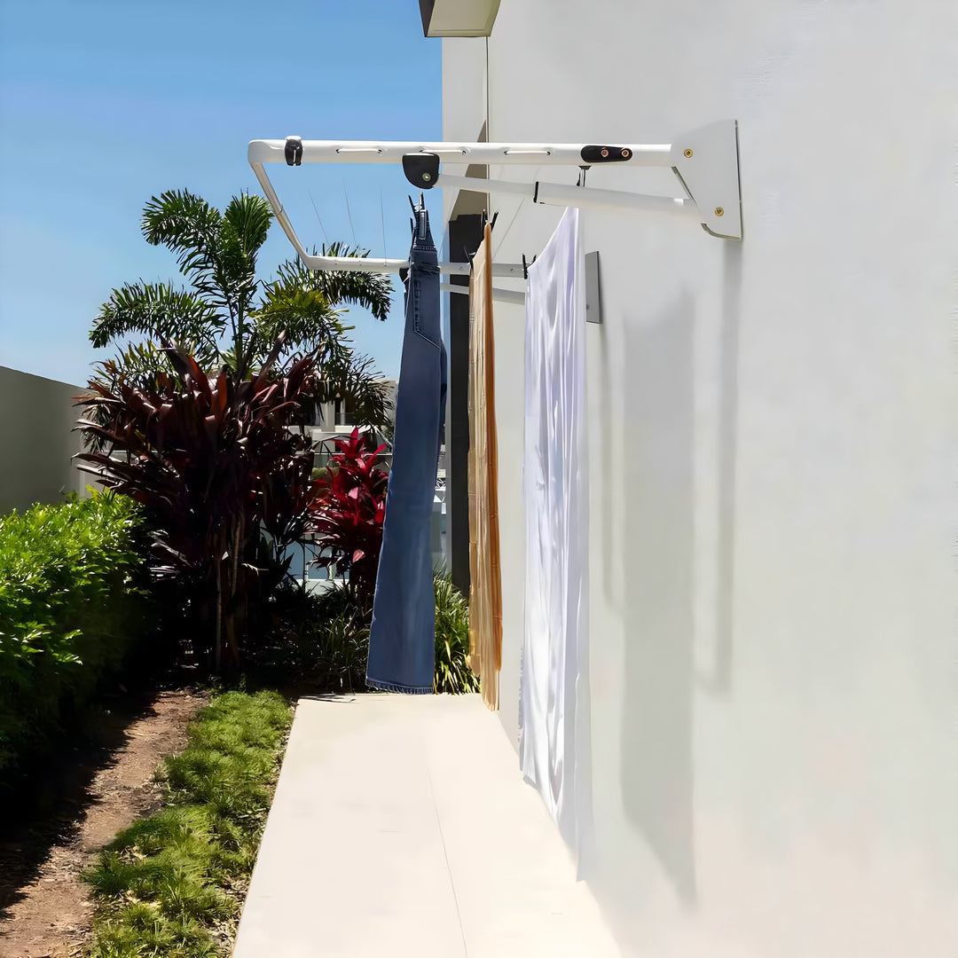 Hills Compact Clothesline in surfmist with laundry hung to dry