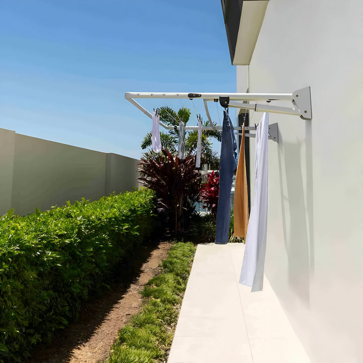 Hills Double Clothesline in surfmist colour with washing on it