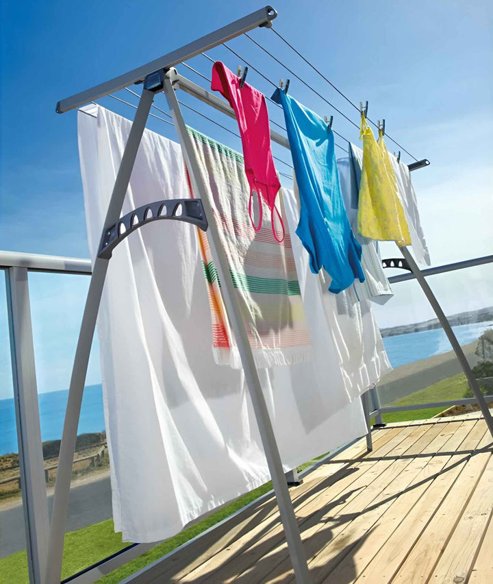 Hills Portable 170 Clothesline drying laundry outdoors on a deck