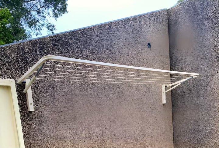 Eco 210 Clothesline installed on a concrete wall